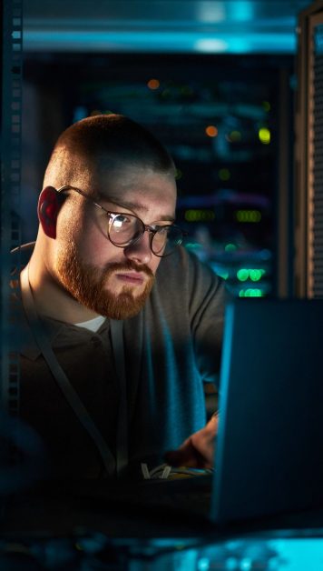 working-on-laptop-in-data-center